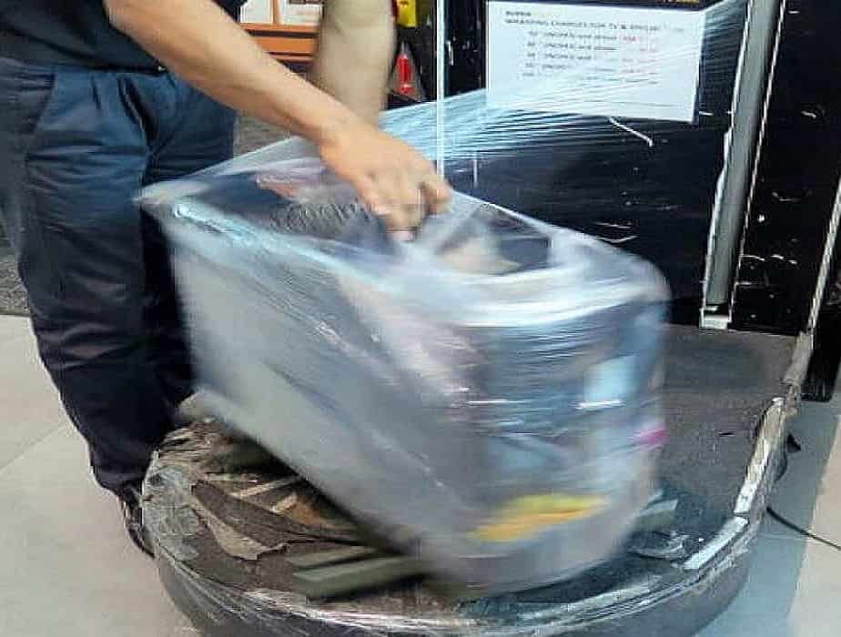 Plastic wrap shop suitcase