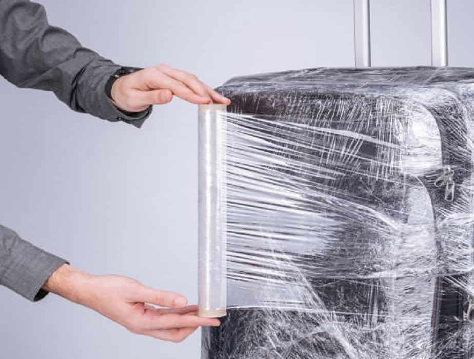 wrapping luggage with household cling film