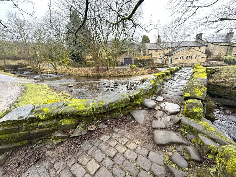 Wycoller Village stone footbridge over the stream in England.