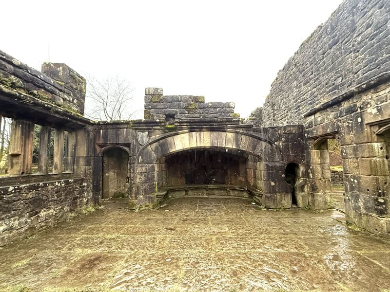 Historic stone ruins in Wycoller Village, England, showcasing ancient architecture and scenic surroundings. Perfect for exploring England's hidden, dreamy villages.